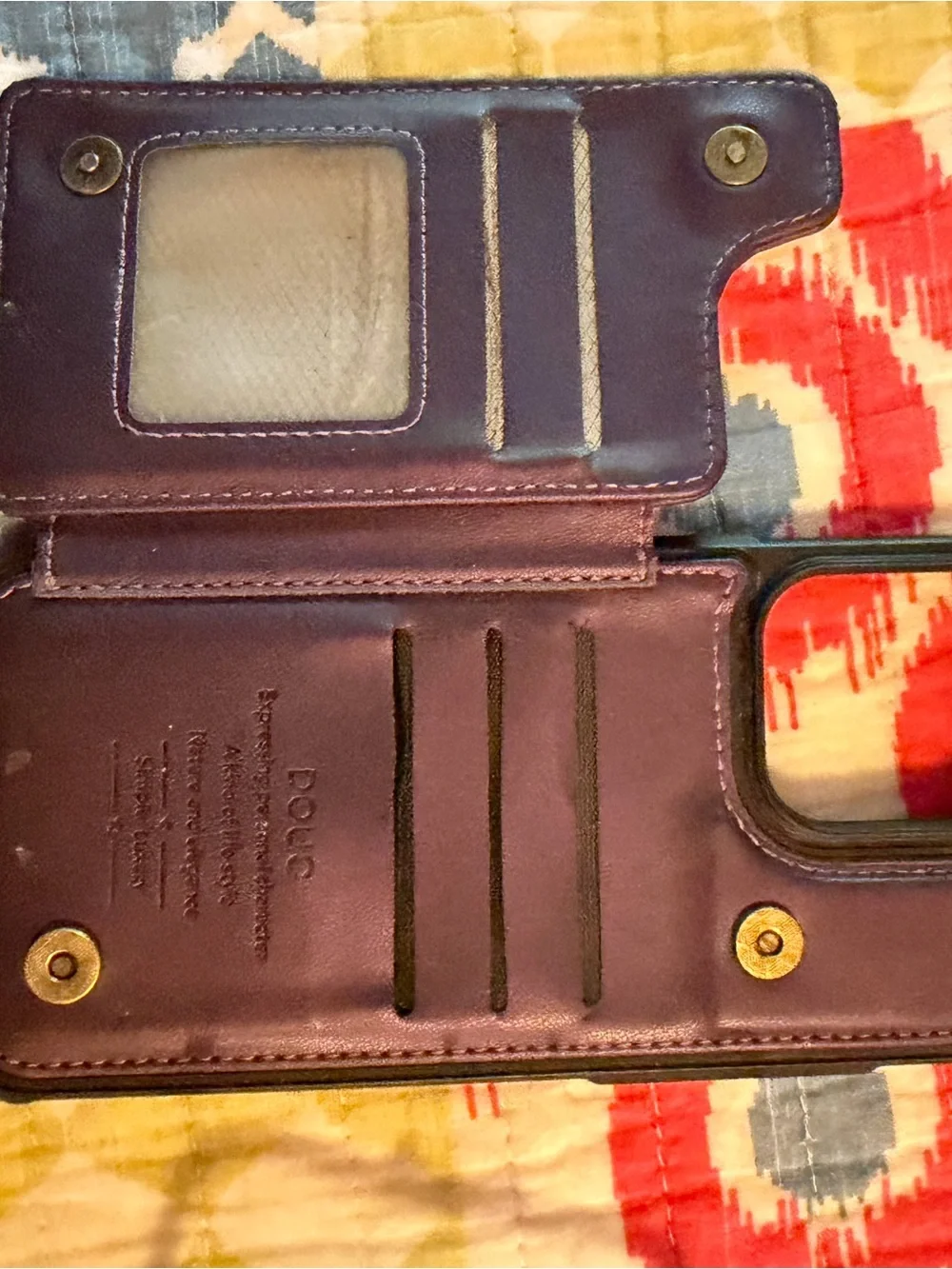 Set of 2 iPhone 16 Pro Max phone cases: one purple Wallet, one black and clear